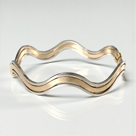 Avon Jewelry - Vintage Avon Wavy Goldtone Silvertone Bangle Bracelet. Two tone.